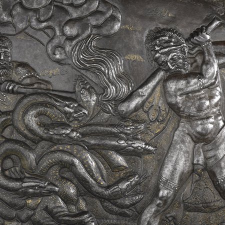 Detail of man swinging bat at sea crab