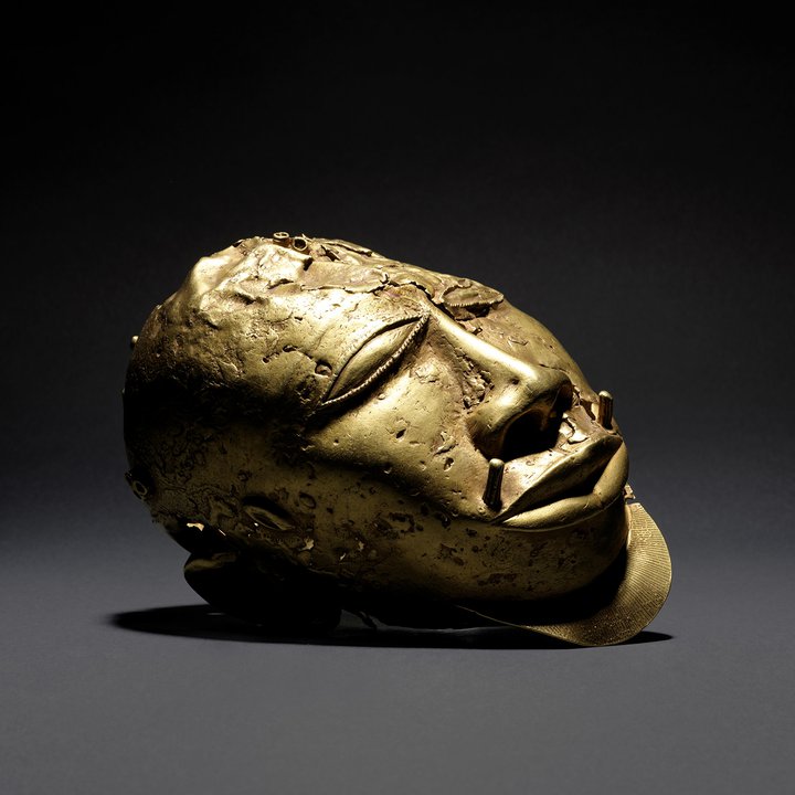 An image of a gold trophy head