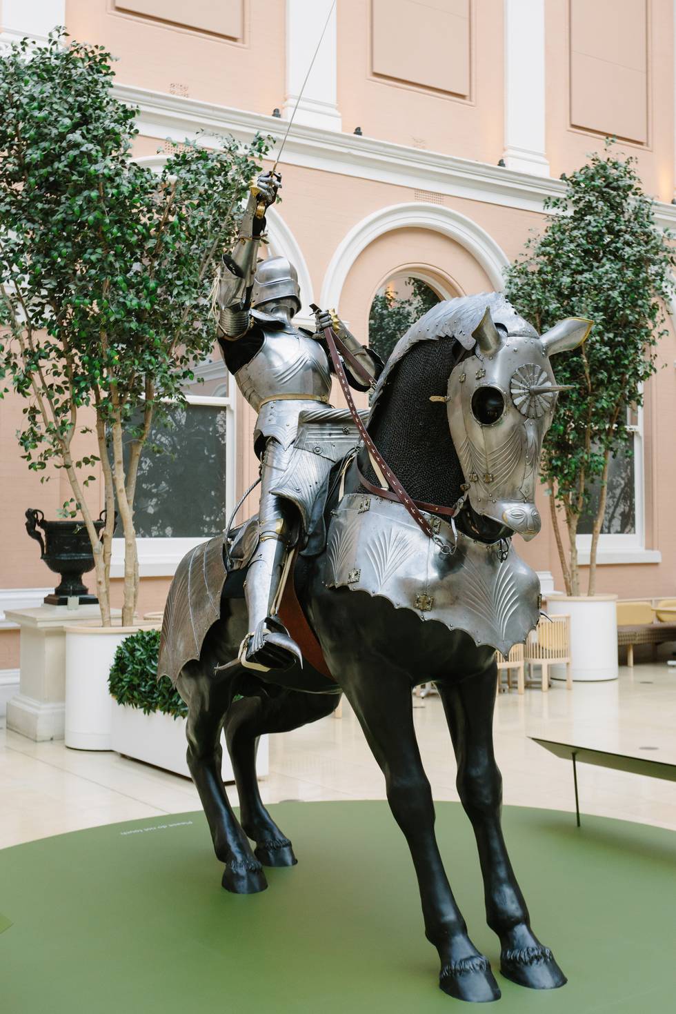 Full length photograph of a medieval knight on an armoured horse