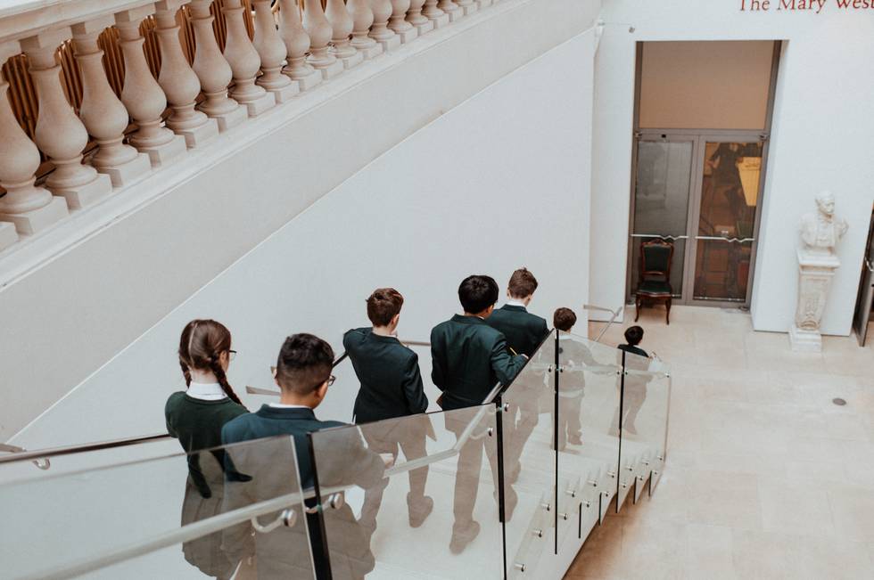 Pupils walking down stairs to the Learning Studio